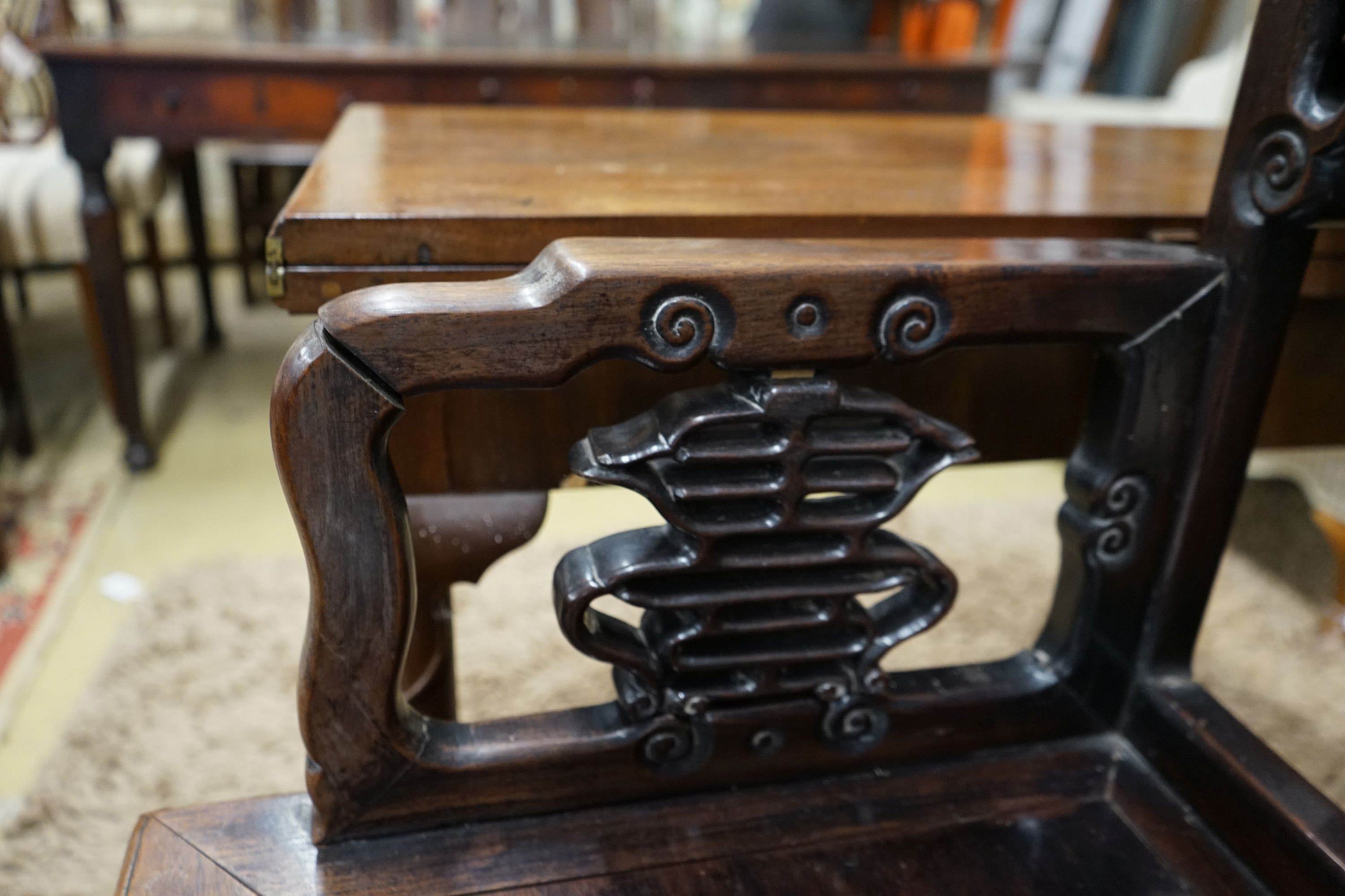 A pair of Chinese carved hongmu elbow chairs (a.f.), width 65cm, depth 48cm, height 96cm
